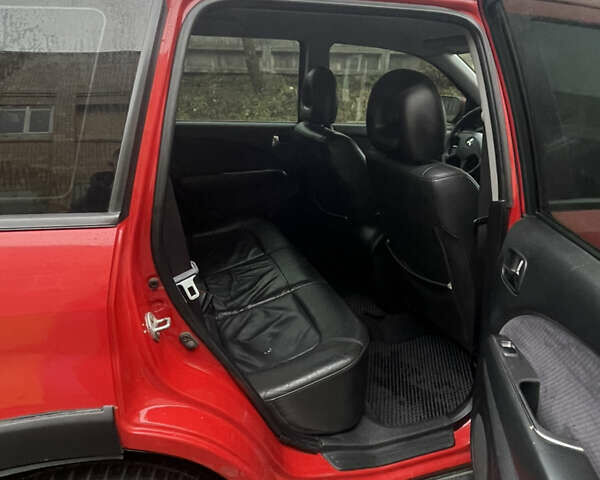 Красный Мицубиси Аутлендер, объемом двигателя 2.4 л и пробегом 224 тыс. км за 5600 $, фото 10 на Automoto.ua