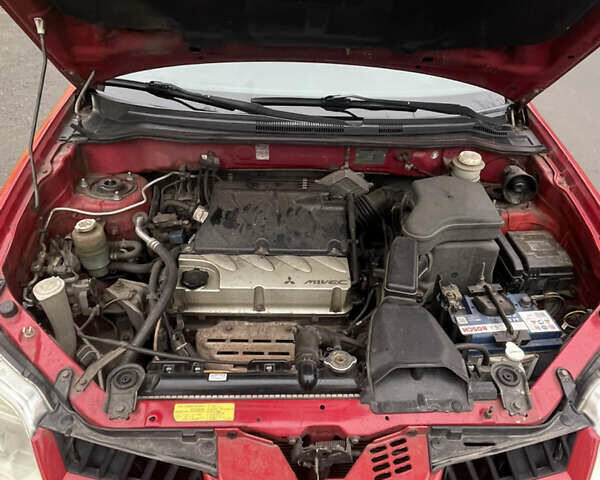 Красный Мицубиси Аутлендер, объемом двигателя 2.4 л и пробегом 224 тыс. км за 5600 $, фото 14 на Automoto.ua