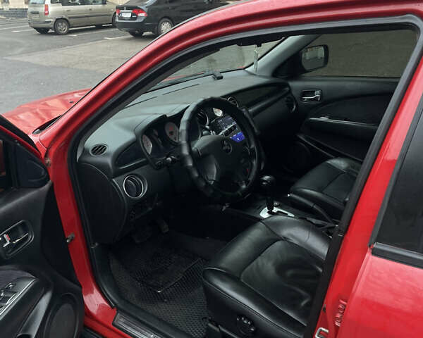 Красный Мицубиси Аутлендер, объемом двигателя 2.4 л и пробегом 224 тыс. км за 5600 $, фото 7 на Automoto.ua