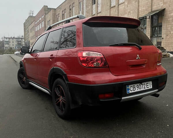 Красный Мицубиси Аутлендер, объемом двигателя 2.4 л и пробегом 224 тыс. км за 5600 $, фото 4 на Automoto.ua