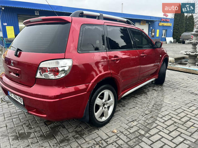 Червоний Міцубісі Аутлендер, об'ємом двигуна 2.4 л та пробігом 187 тис. км за 5600 $, фото 2 на Automoto.ua