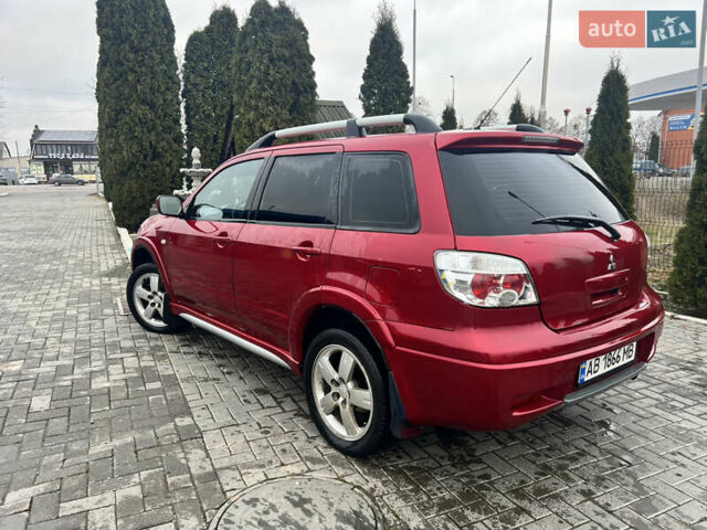 Червоний Міцубісі Аутлендер, об'ємом двигуна 2.4 л та пробігом 187 тис. км за 5600 $, фото 4 на Automoto.ua