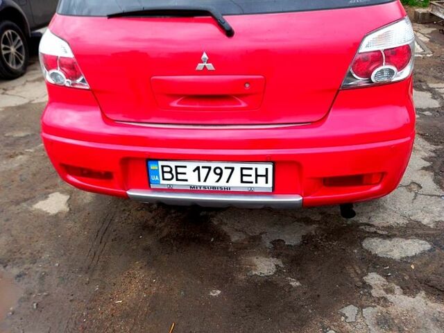 Червоний Міцубісі Аутлендер, об'ємом двигуна 2.4 л та пробігом 217 тис. км за 7000 $, фото 1 на Automoto.ua
