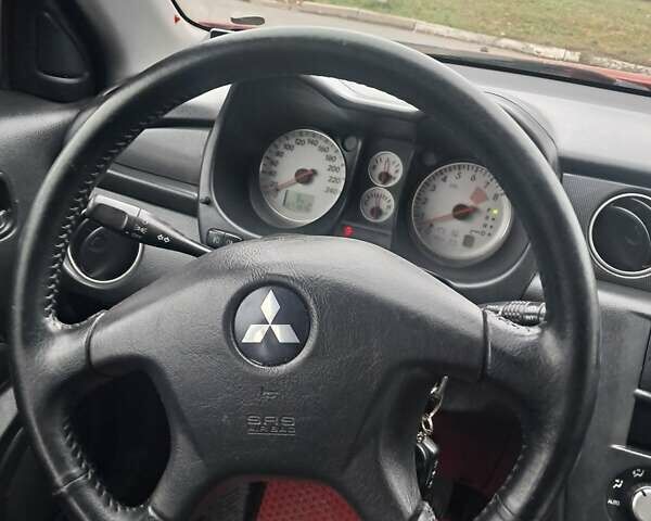 Красный Мицубиси Аутлендер, объемом двигателя 2.4 л и пробегом 269 тыс. км за 5700 $, фото 27 на Automoto.ua