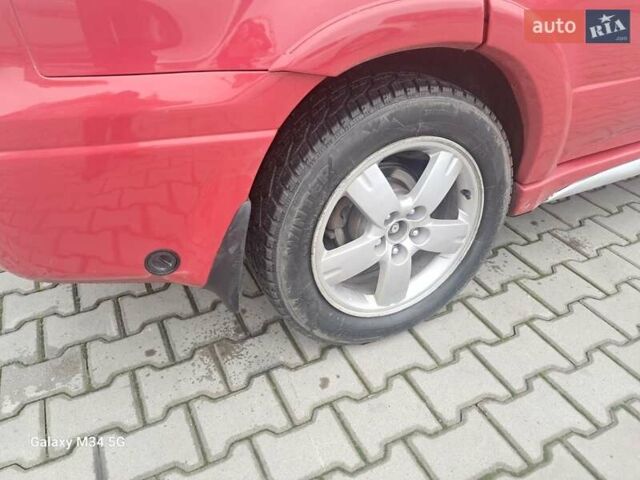 Красный Мицубиси Аутлендер, объемом двигателя 2.4 л и пробегом 269 тыс. км за 5700 $, фото 20 на Automoto.ua