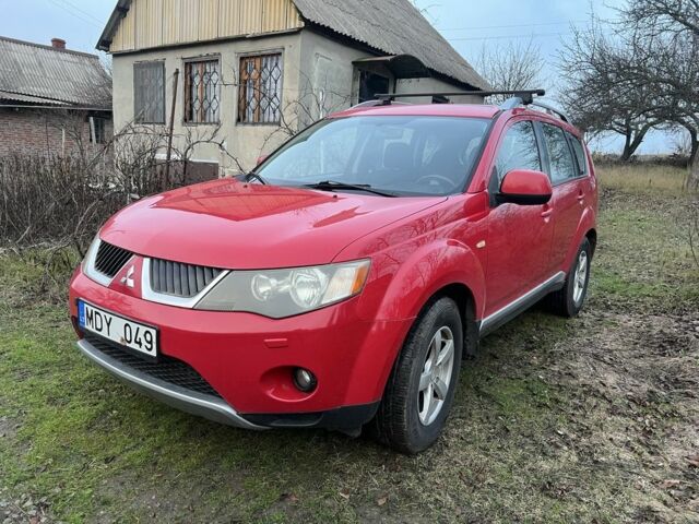 Красный Мицубиси Аутлендер, объемом двигателя 2 л и пробегом 290 тыс. км за 4700 $, фото 1 на Automoto.ua