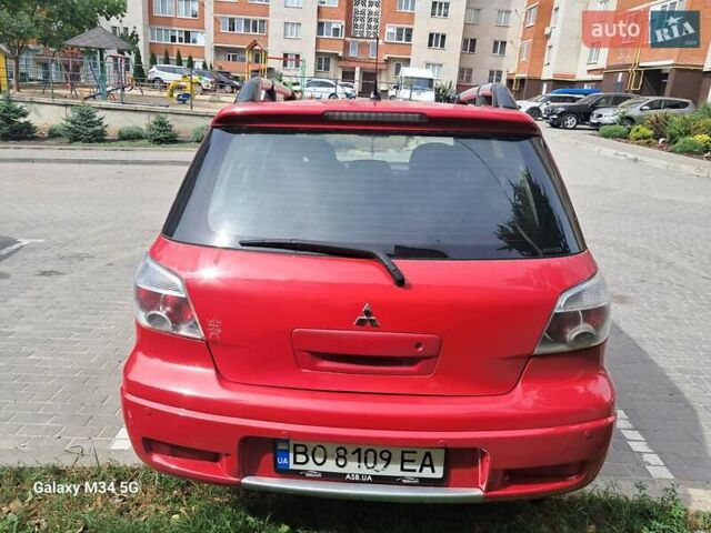 Червоний Міцубісі Аутлендер, об'ємом двигуна 2.4 л та пробігом 265 тис. км за 5300 $, фото 11 на Automoto.ua