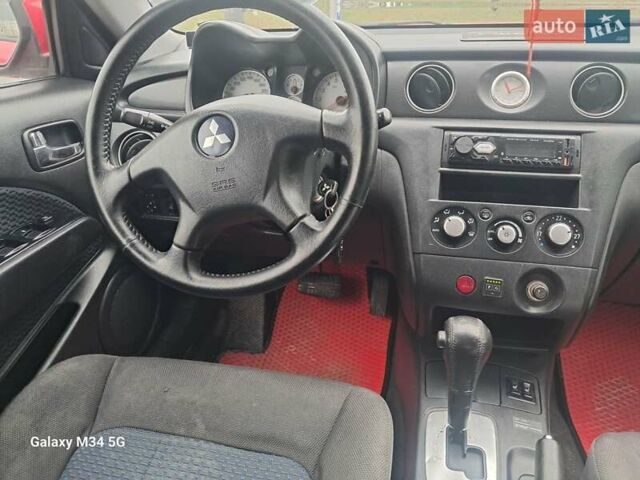 Красный Мицубиси Аутлендер, объемом двигателя 2.4 л и пробегом 269 тыс. км за 5700 $, фото 28 на Automoto.ua