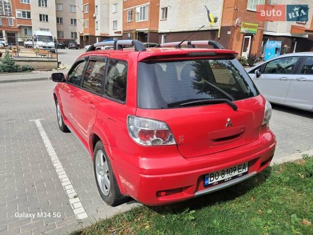 Червоний Міцубісі Аутлендер, об'ємом двигуна 2.4 л та пробігом 265 тис. км за 5300 $, фото 13 на Automoto.ua