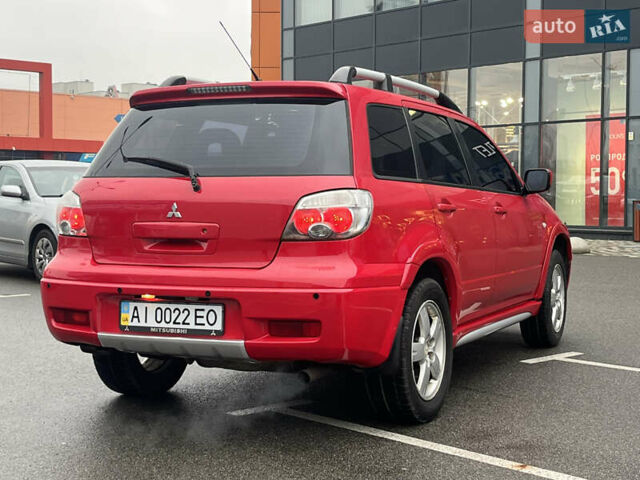 Червоний Міцубісі Аутлендер, об'ємом двигуна 2.4 л та пробігом 308 тис. км за 5990 $, фото 5 на Automoto.ua