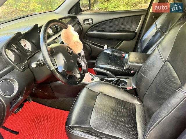 Червоний Міцубісі Аутлендер, об'ємом двигуна 2.4 л та пробігом 187 тис. км за 5600 $, фото 7 на Automoto.ua