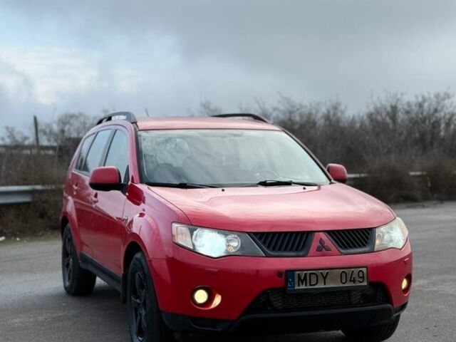 Красный Мицубиси Аутлендер, объемом двигателя 2 л и пробегом 290 тыс. км за 5200 $, фото 1 на Automoto.ua