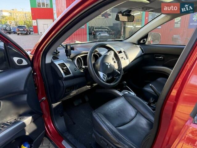 Красный Мицубиси Аутлендер, объемом двигателя 2.36 л и пробегом 143 тыс. км за 8500 $, фото 11 на Automoto.ua