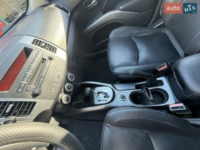 Красный Мицубиси Аутлендер, объемом двигателя 2.36 л и пробегом 143 тыс. км за 8500 $, фото 9 на Automoto.ua