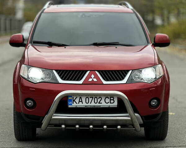 Красный Мицубиси Аутлендер, объемом двигателя 2.4 л и пробегом 180 тыс. км за 8900 $, фото 2 на Automoto.ua