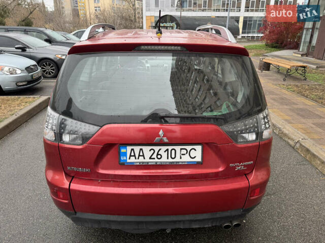 Красный Мицубиси Аутлендер, объемом двигателя 3 л и пробегом 204 тыс. км за 8200 $, фото 2 на Automoto.ua