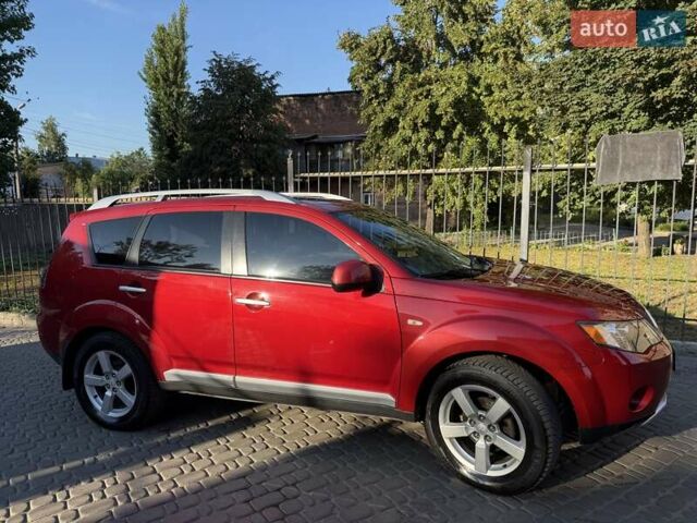 Красный Мицубиси Аутлендер, объемом двигателя 2.36 л и пробегом 143 тыс. км за 8500 $, фото 3 на Automoto.ua