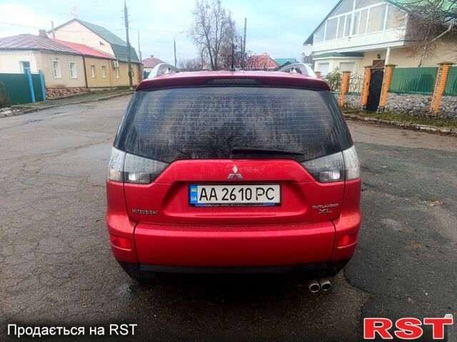 Красный Мицубиси Аутлендер, объемом двигателя 3 л и пробегом 205 тыс. км за 9000 $, фото 3 на Automoto.ua