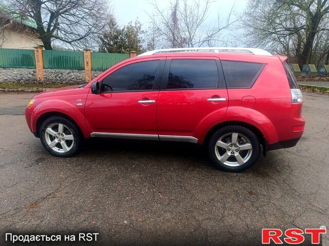 Красный Мицубиси Аутлендер, объемом двигателя 3 л и пробегом 205 тыс. км за 9000 $, фото 6 на Automoto.ua