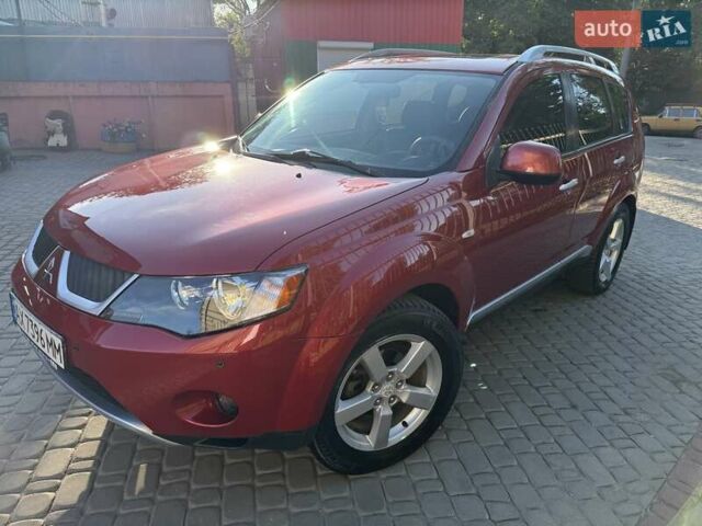 Красный Мицубиси Аутлендер, объемом двигателя 2.36 л и пробегом 143 тыс. км за 8500 $, фото 1 на Automoto.ua