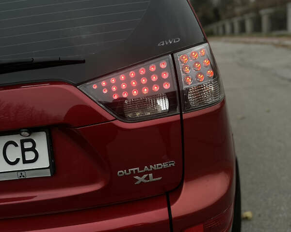 Красный Мицубиси Аутлендер, объемом двигателя 2.4 л и пробегом 180 тыс. км за 8900 $, фото 47 на Automoto.ua