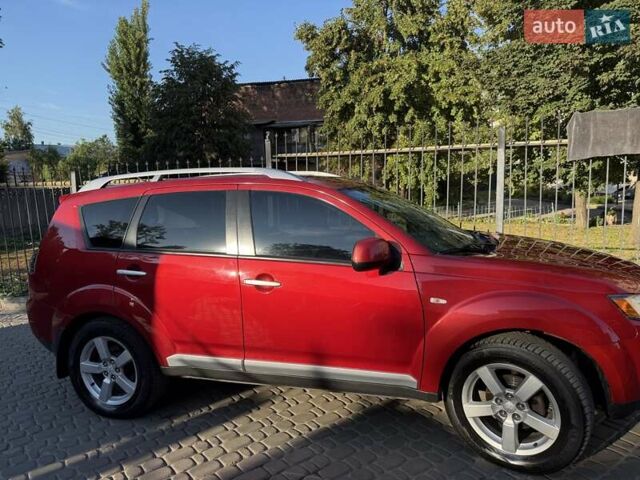 Красный Мицубиси Аутлендер, объемом двигателя 2.36 л и пробегом 143 тыс. км за 8500 $, фото 2 на Automoto.ua