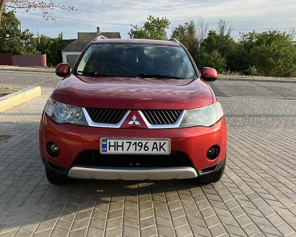 Красный Мицубиси Аутлендер, объемом двигателя 2.36 л и пробегом 200 тыс. км за 11200 $, фото 1 на Automoto.ua