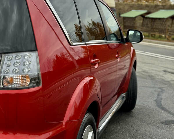 Красный Мицубиси Аутлендер, объемом двигателя 2 л и пробегом 204 тыс. км за 10350 $, фото 15 на Automoto.ua