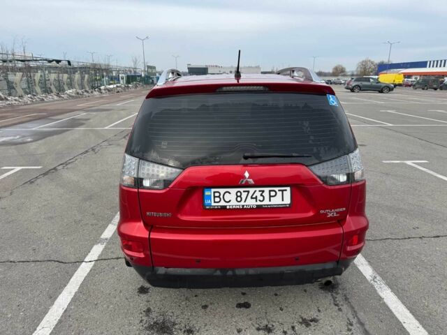 Красный Мицубиси Аутлендер, объемом двигателя 2.4 л и пробегом 201 тыс. км за 9750 $, фото 1 на Automoto.ua