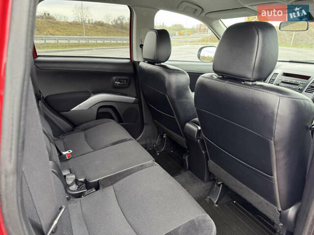 Красный Мицубиси Аутлендер, объемом двигателя 2 л и пробегом 204 тыс. км за 10350 $, фото 35 на Automoto.ua