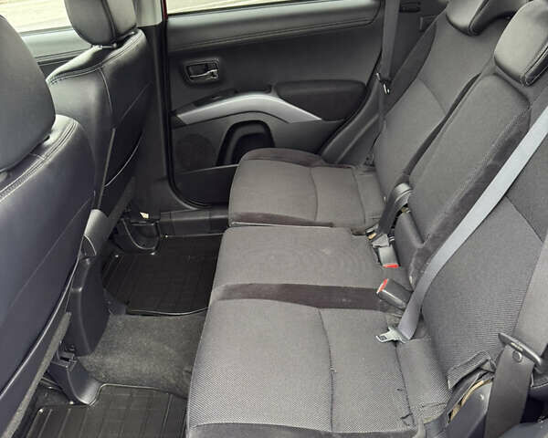 Красный Мицубиси Аутлендер, объемом двигателя 2 л и пробегом 204 тыс. км за 10350 $, фото 29 на Automoto.ua