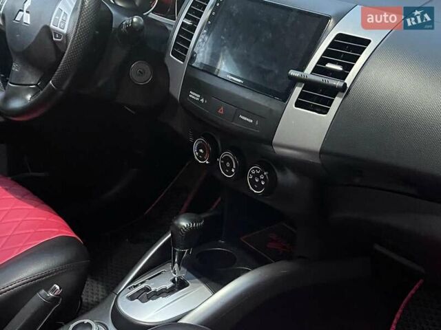 Красный Мицубиси Аутлендер, объемом двигателя 2.4 л и пробегом 251 тыс. км за 8990 $, фото 16 на Automoto.ua