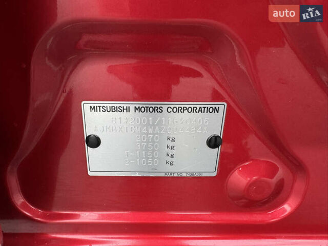 Красный Мицубиси Аутлендер, объемом двигателя 2 л и пробегом 204 тыс. км за 10350 $, фото 39 на Automoto.ua