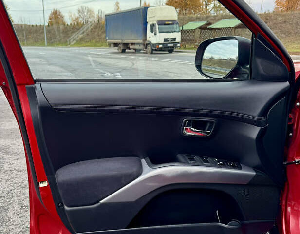 Красный Мицубиси Аутлендер, объемом двигателя 2 л и пробегом 204 тыс. км за 10350 $, фото 27 на Automoto.ua