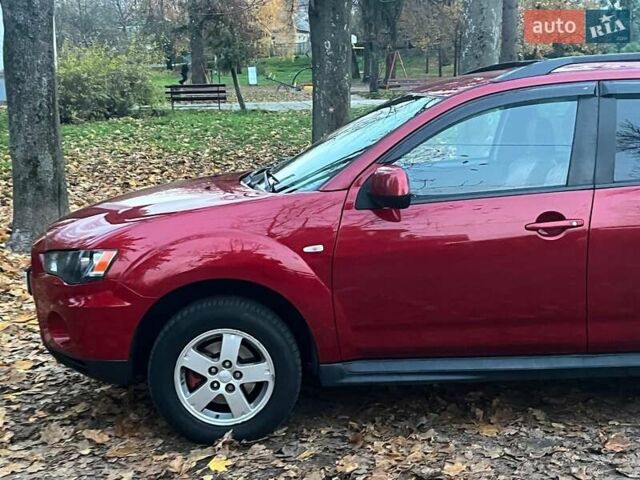 Красный Мицубиси Аутлендер, объемом двигателя 2.4 л и пробегом 251 тыс. км за 8990 $, фото 4 на Automoto.ua