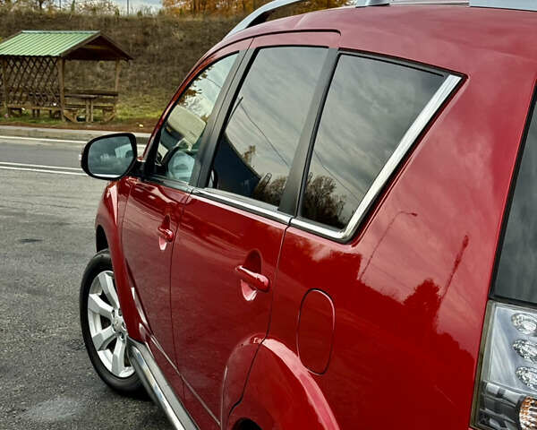 Красный Мицубиси Аутлендер, объемом двигателя 2 л и пробегом 204 тыс. км за 10350 $, фото 16 на Automoto.ua