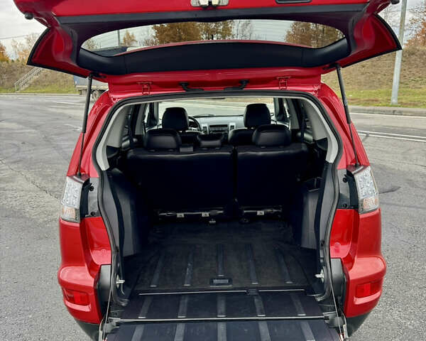 Красный Мицубиси Аутлендер, объемом двигателя 2 л и пробегом 204 тыс. км за 10350 $, фото 37 на Automoto.ua