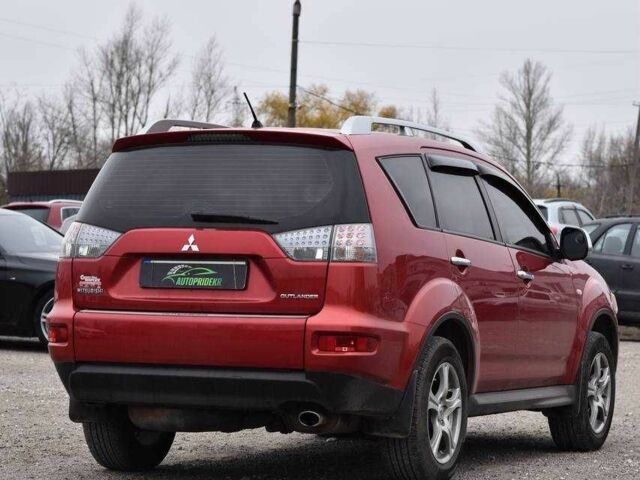 Красный Мицубиси Аутлендер, объемом двигателя 2.4 л и пробегом 204 тыс. км за 9499 $, фото 1 на Automoto.ua