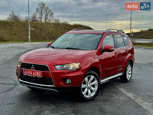 Красный Мицубиси Аутлендер, объемом двигателя 2 л и пробегом 204 тыс. км за 10350 $, фото 2 на Automoto.ua