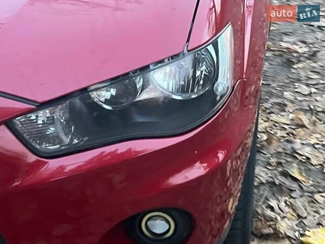 Красный Мицубиси Аутлендер, объемом двигателя 2.4 л и пробегом 251 тыс. км за 8990 $, фото 5 на Automoto.ua