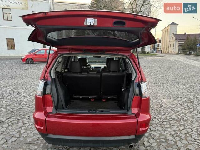 Красный Мицубиси Аутлендер, объемом двигателя 2.36 л и пробегом 134 тыс. км за 10600 $, фото 10 на Automoto.ua