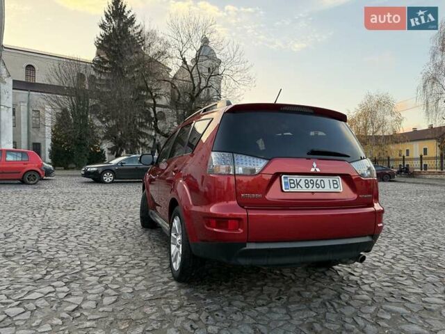 Красный Мицубиси Аутлендер, объемом двигателя 2.36 л и пробегом 134 тыс. км за 10600 $, фото 3 на Automoto.ua