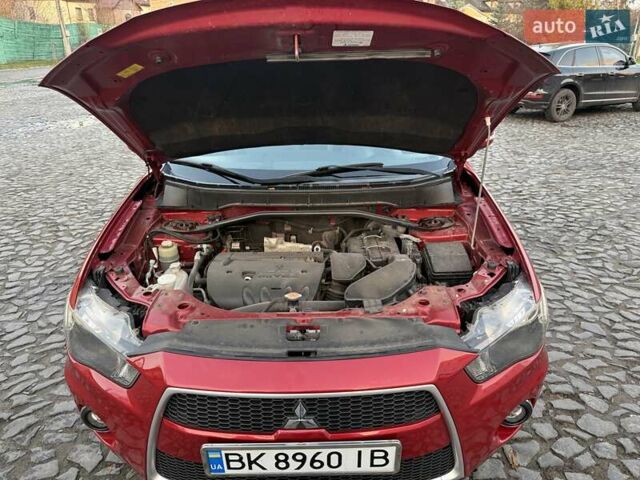 Красный Мицубиси Аутлендер, объемом двигателя 2.36 л и пробегом 134 тыс. км за 10600 $, фото 17 на Automoto.ua