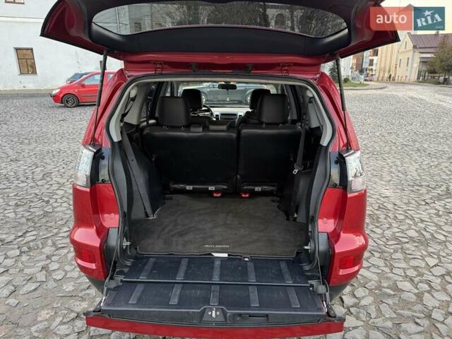 Красный Мицубиси Аутлендер, объемом двигателя 2.36 л и пробегом 134 тыс. км за 10600 $, фото 11 на Automoto.ua