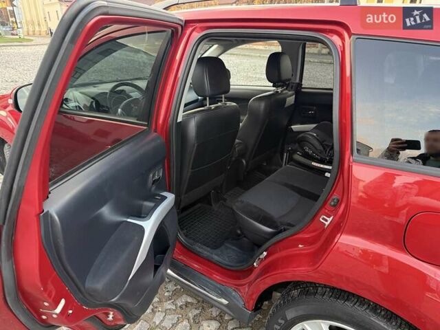 Красный Мицубиси Аутлендер, объемом двигателя 2.36 л и пробегом 134 тыс. км за 10600 $, фото 9 на Automoto.ua