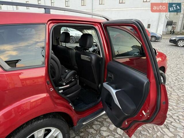 Красный Мицубиси Аутлендер, объемом двигателя 2.36 л и пробегом 134 тыс. км за 10600 $, фото 8 на Automoto.ua