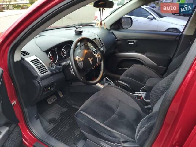 Красный Мицубиси Аутлендер, объемом двигателя 2.36 л и пробегом 93 тыс. км за 11499 $, фото 18 на Automoto.ua