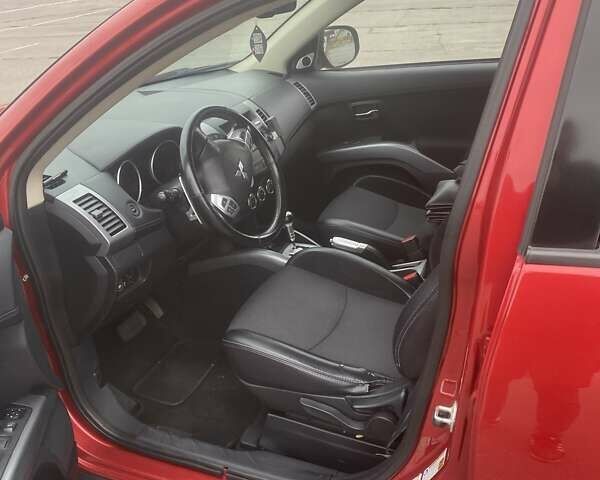 Красный Мицубиси Аутлендер, объемом двигателя 2.36 л и пробегом 210 тыс. км за 11800 $, фото 10 на Automoto.ua