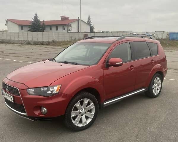 Красный Мицубиси Аутлендер, объемом двигателя 2.36 л и пробегом 210 тыс. км за 11800 $, фото 2 на Automoto.ua