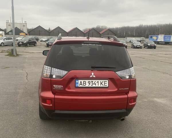 Красный Мицубиси Аутлендер, объемом двигателя 2.36 л и пробегом 210 тыс. км за 11800 $, фото 1 на Automoto.ua
